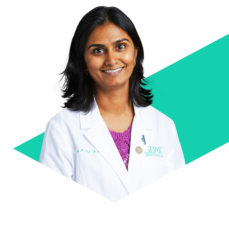 Photo of Tanvi Shah inside a green triangular shape.