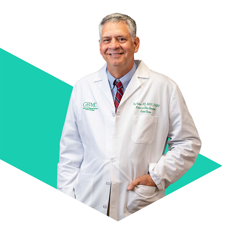 Photo of Tanvi Shah inside a green triangular shape.